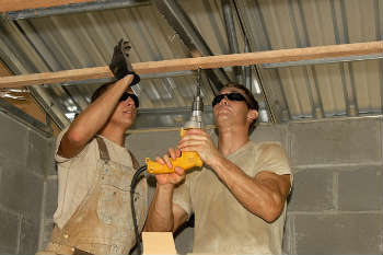 Construction workers drilling